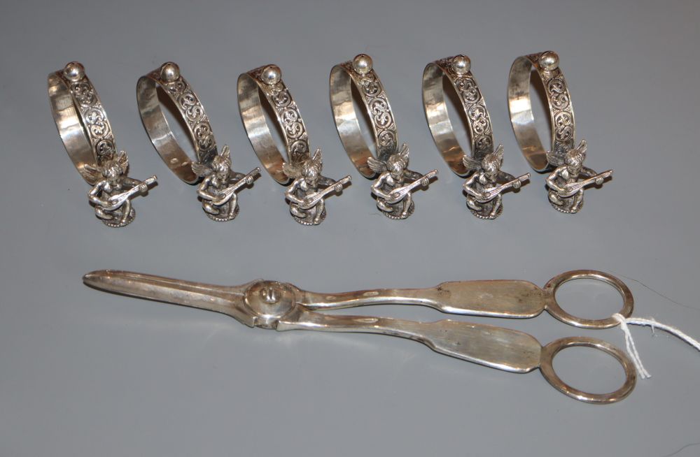 A pair of Victorian plain silver grape shears, London, 1871, 18.5cm and 6 napkin rings